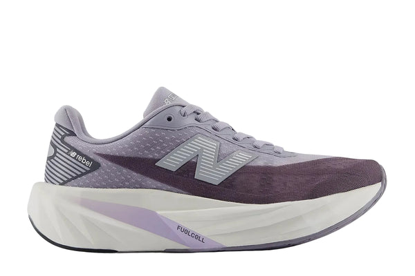 Purple running shoe with white sole on a light gray background
