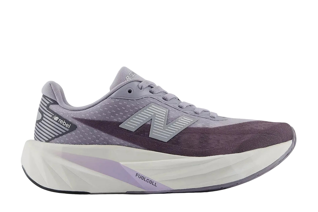 Purple running shoe with white sole on a light gray background